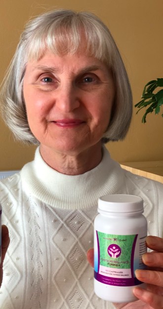 Martin Clinic customer holding Thyroid Support Formula