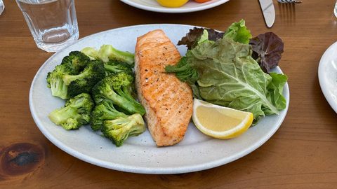 A cooked salmon fillet on a plate