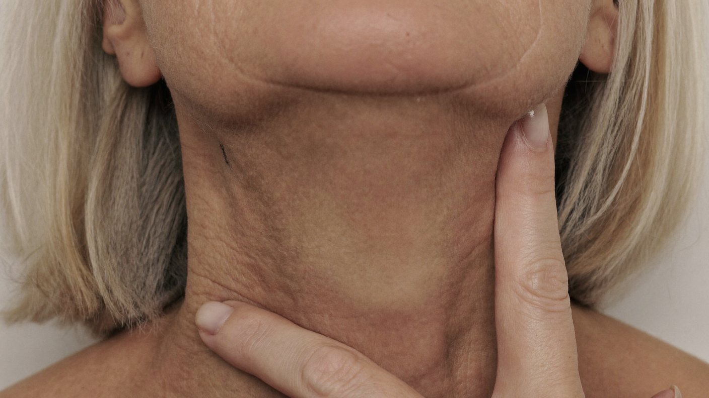 Close-up of the base of a woman's throat