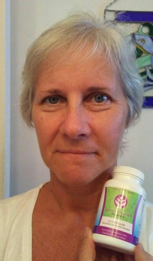 Martin Clinic customer holding Thyroid Support Formula
