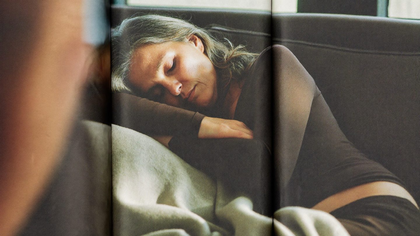 A woman asleep on the sofa in the middle of the afternoon